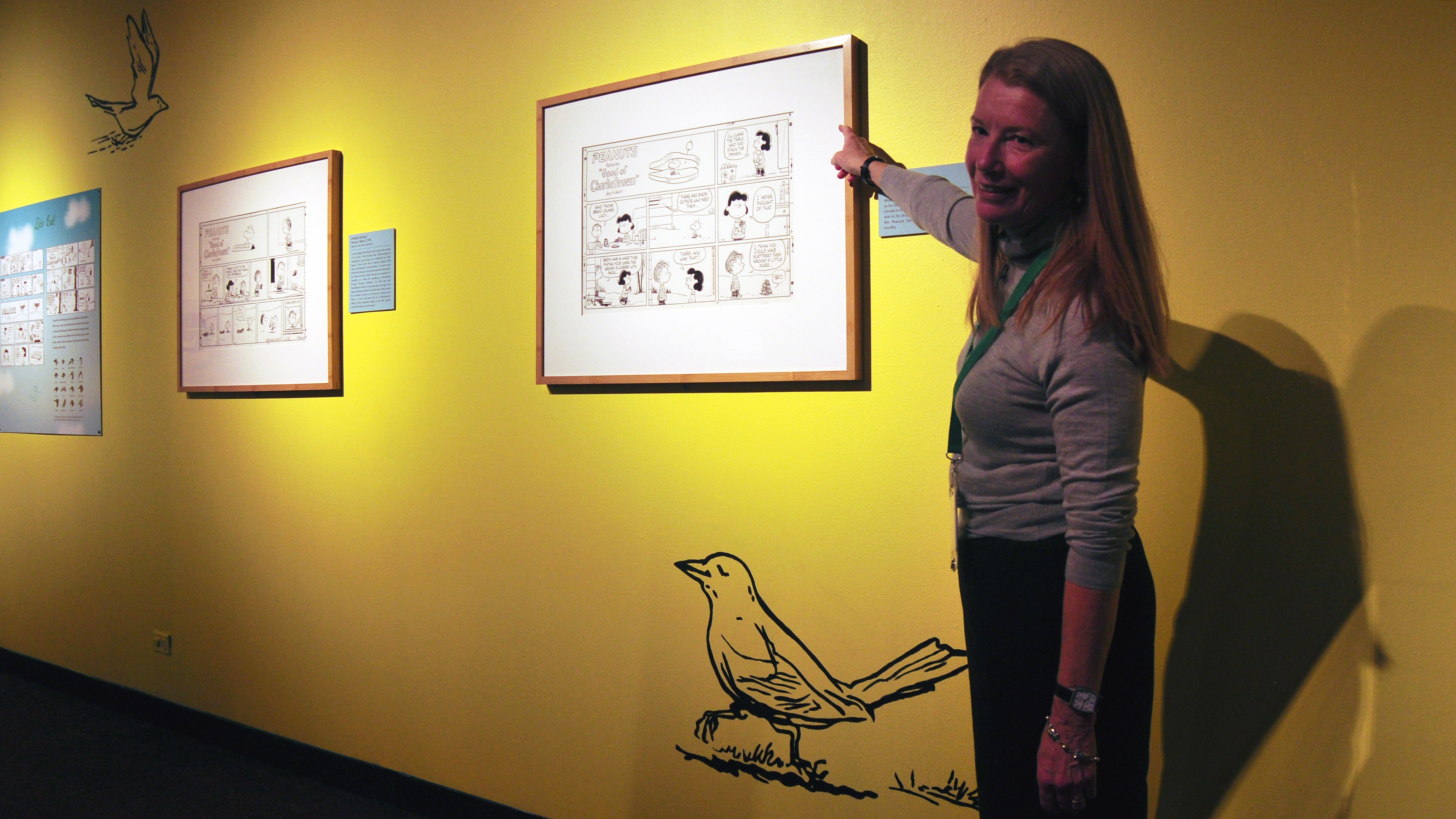 Nature Museum President and CEO Deborah Lahey in the "Birds" section of the "Peanuts ... Naturally" exhibit (Sean Keenehan)