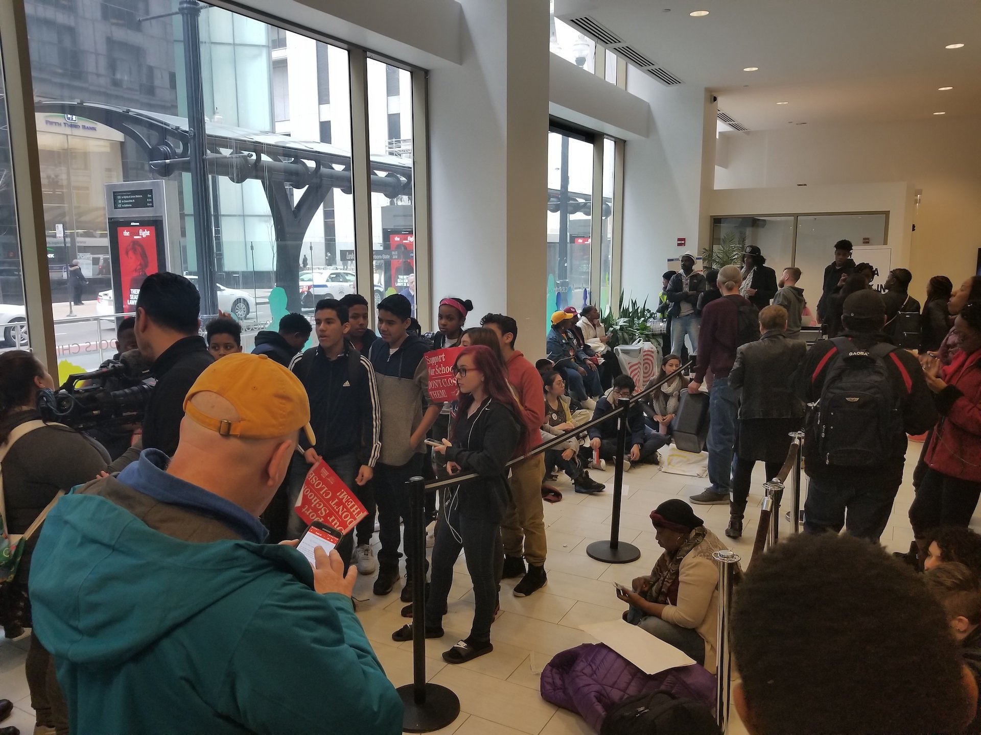 Students from the four Englewood schools packed the lobby at CPS Central Office during Wednesday's board meeting. (Matt Masterson / Chicago Tonight)