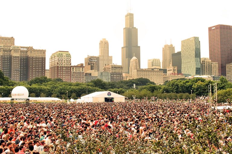 Alleged Las Vegas gunman Stephen Paddock reportedly booked multiple rooms at the Blackstone Hotel (red and white building, second from left) in August overlooking Lollapalooza. (EMR / Flickr)