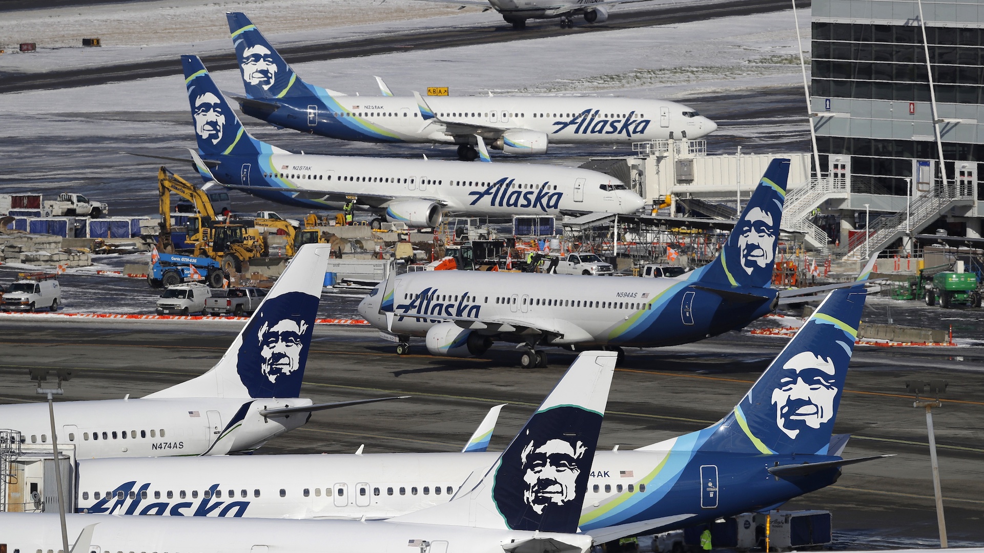 In this Feb. 5, 2019, file photo, Alaska Airlines planes are parked at a gate area at Seattle-Tacoma International Airport in Seattle. Alaska Airlines said over 300 employees among the company's workforce in Anchorage may lose their jobs on Oct. 1, 2020. (AP Photo/Ted S. Warren, File)