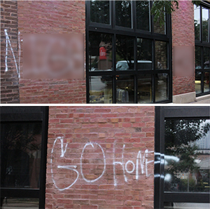 Racist graffiti tagged on the Nouveau Tavern's building.