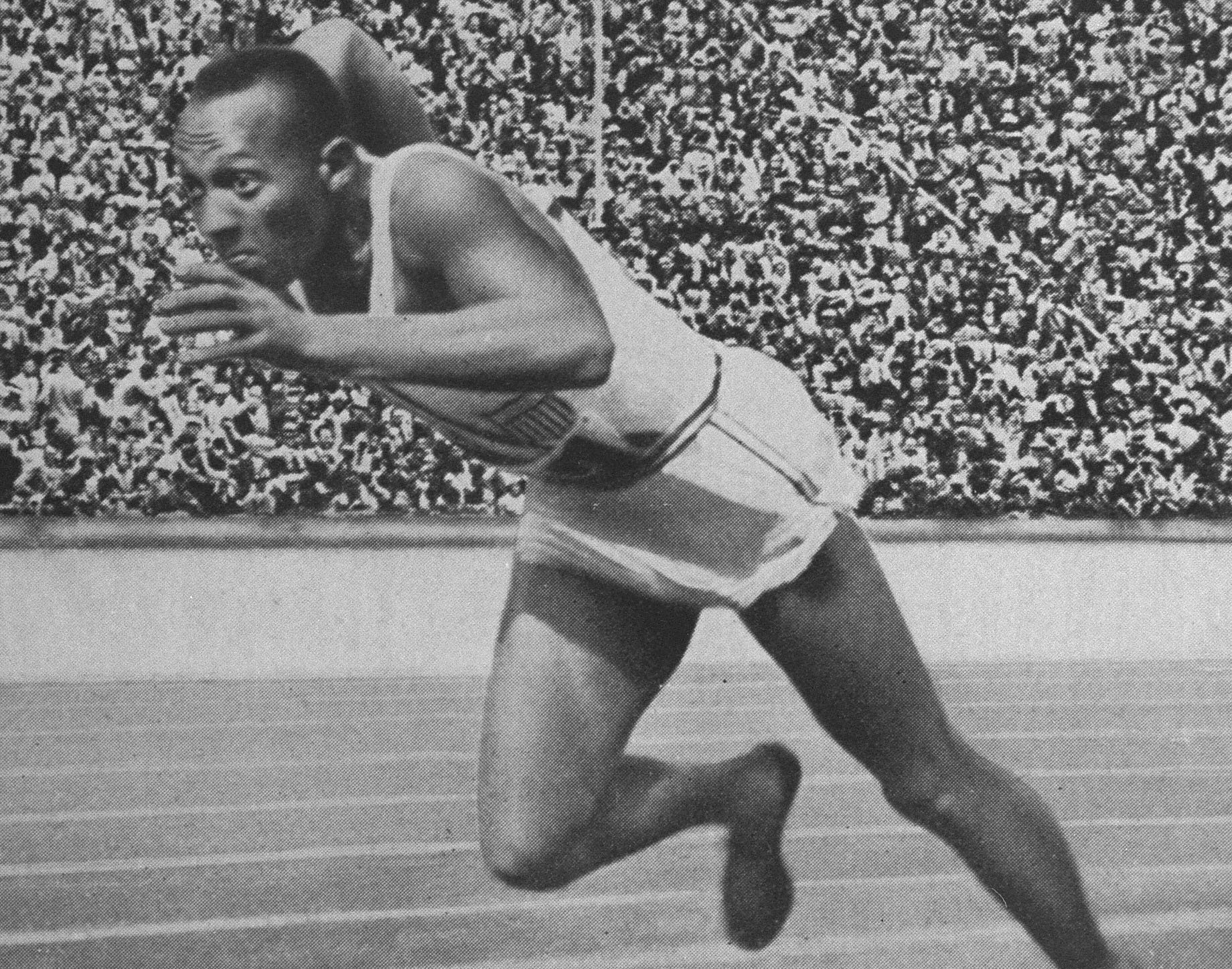 American Olympic athlete Jesse Owens running his historic 200 meter race at the 1936 Berlin Olympics. (Courtesy of the U.S. Holocaust Memorial Museum/Library of Congress)