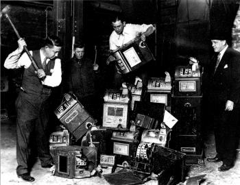 Police destroying illegal slot machines. Courtesy of Charles Molnar, private collection.