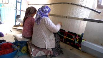 Turkish weavers harvest the "fruit of the loom."