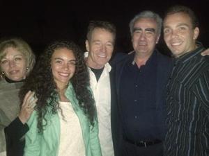 Marius Stan and his family pose for a picture with Bryan Cranston.