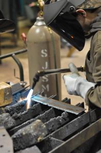 An introductory welding student at Illinois Central College works on an assignment. / Michael Lipkin