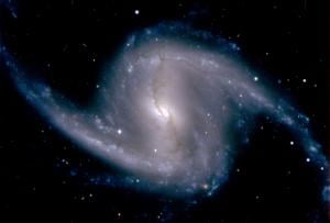  Zoomed-in image from the Dark Energy Camera of the barred spiral galaxy NGC 1365, in the Fornax cluster of galaxies, which lies about 60 million light years from Earth; Photo by Dark Energy Survey Collaboration