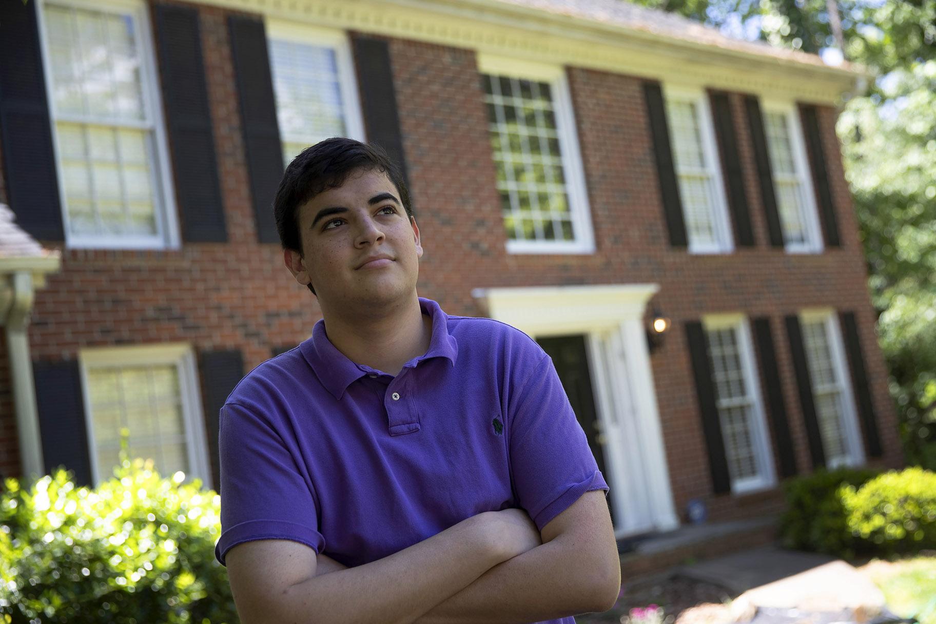 College student Jake Mershon poses in front of his parents home Thursday, May 7, 2020, in Roswell Ga. (AP Photo / John Bazemore)