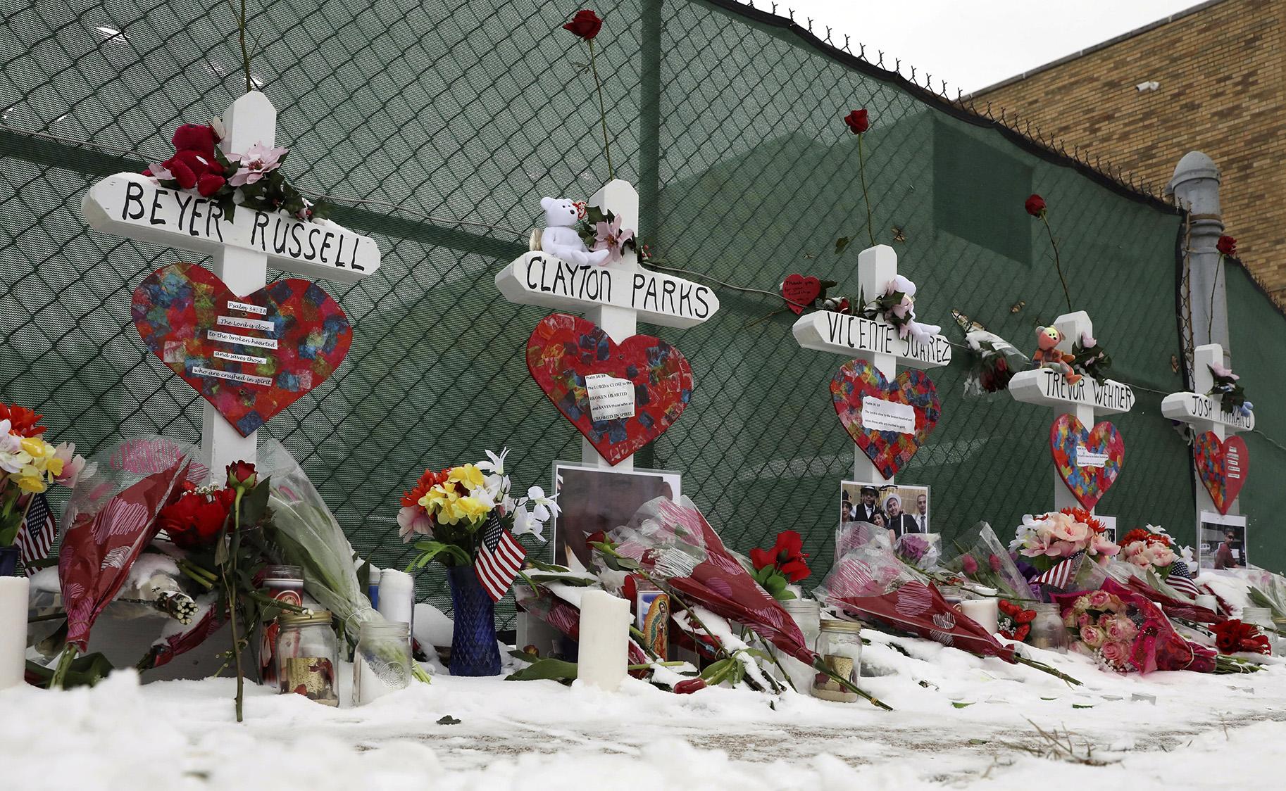 Crosses are placed for the victims of a mass shooting Sunday, Feb. 17, 2019, in Aurora, near Henry Pratt Co. manufacturing company where several were killed on Friday. (AP Photo / Nam Y. Huh)