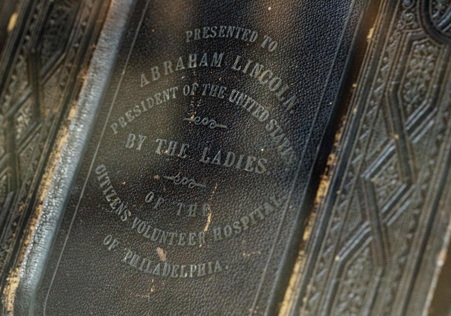 A King James version of the Bible, likely given to Abraham Lincoln in June 1864, that was later passed on by widow Mary Lincoln to her beloved Springfield neighbor Noyes W. Miner, a Baptist minister, is displayed at the Abraham Lincoln Presidential Library and Museum, where executive director Alan Lowe unveiled it, Thursday, June 20, 2019, in Springfield, Illinois. (Ted Schurter / The State Journal-Register via AP)