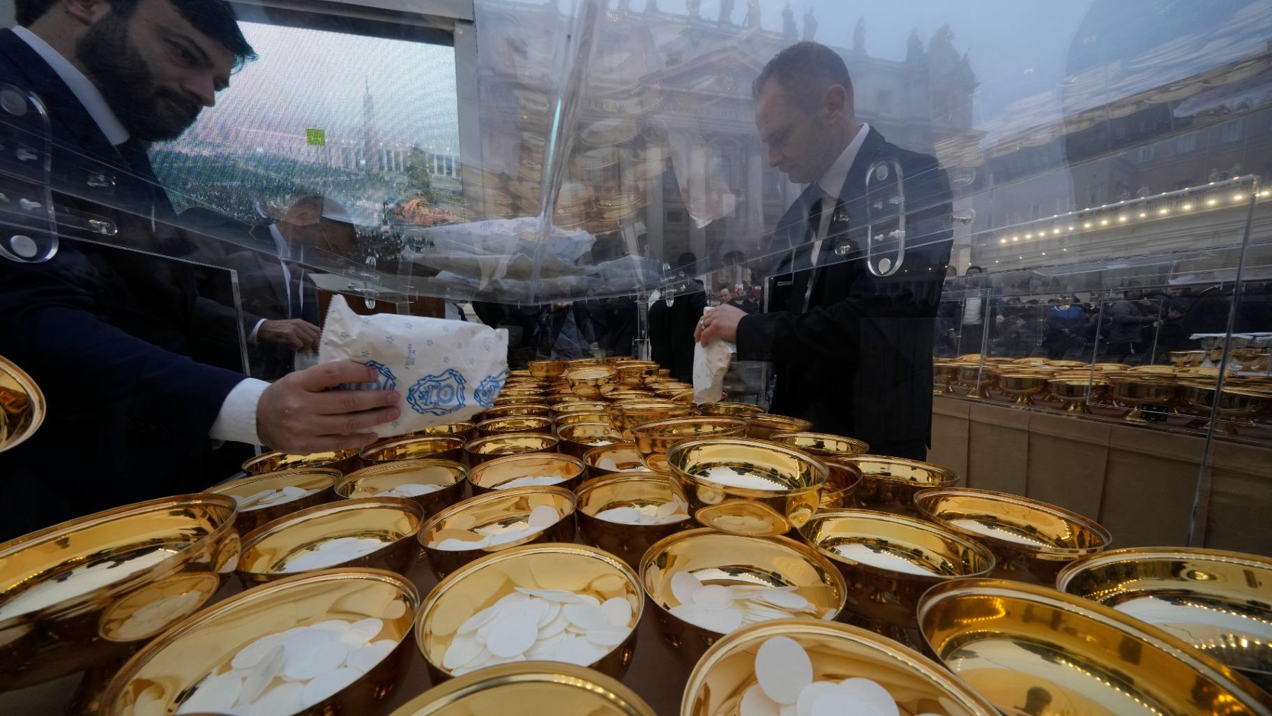 Holy communion vessels are filled ahead of the funeral mass for late Pope Emeritus Benedict XVI in St. Peter's Square at the Vatican, Thursday, Jan. 5, 2023. (AP Photo / Andrew Medichini)