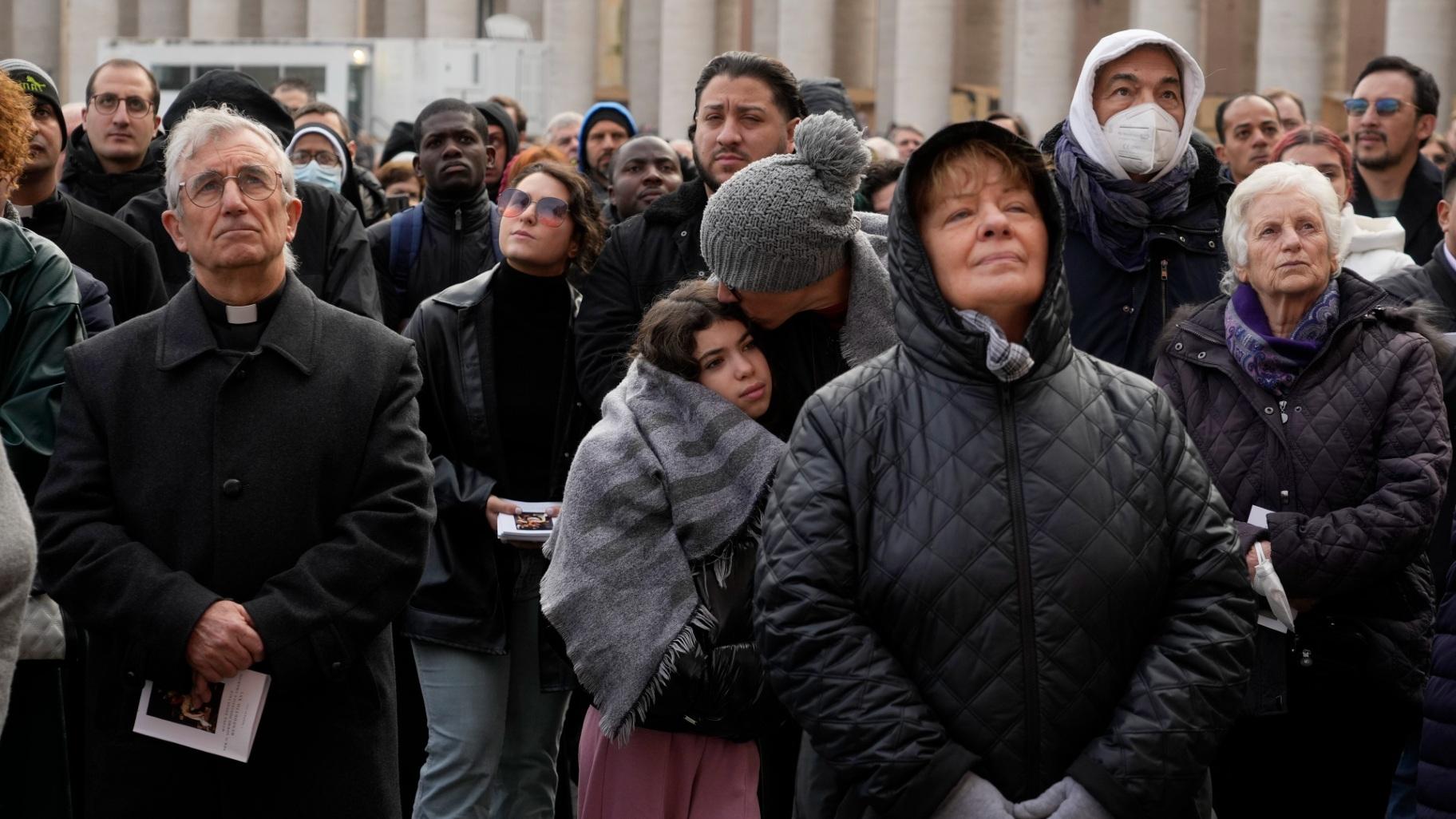 Faithful attend the funeral mass for late Pope Emeritus Benedict XVI in St. Peter's Square at the Vatican, Thursday, Jan. 5, 2023. (AP Photo / Gregorio Borgia)
