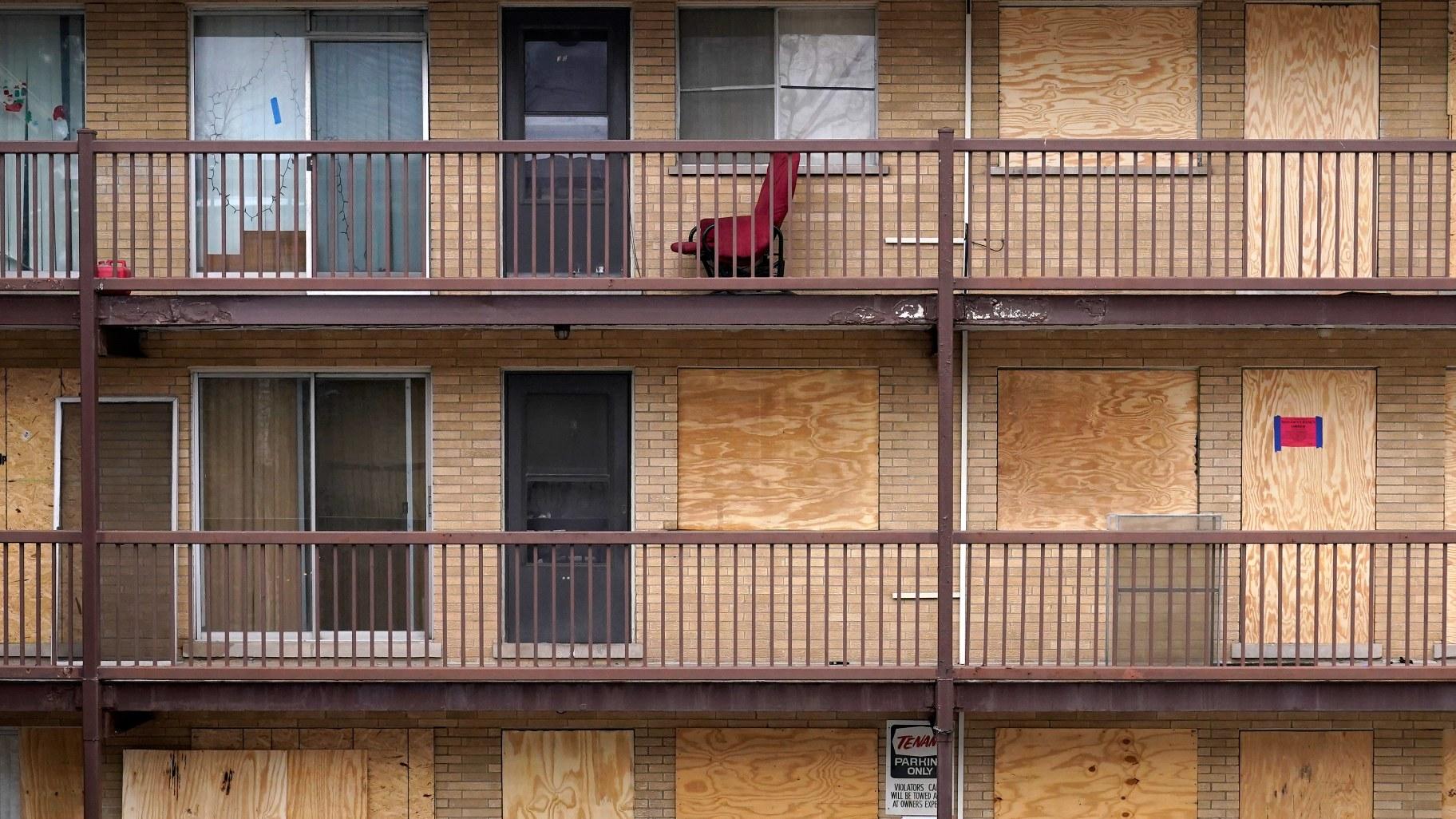 Various apartments at an apartment complex Monday, Jan. 8, 2024, in Harvey, Ill., are boarded up where some are not. (AP Photo / Charles Rex Arbogast)