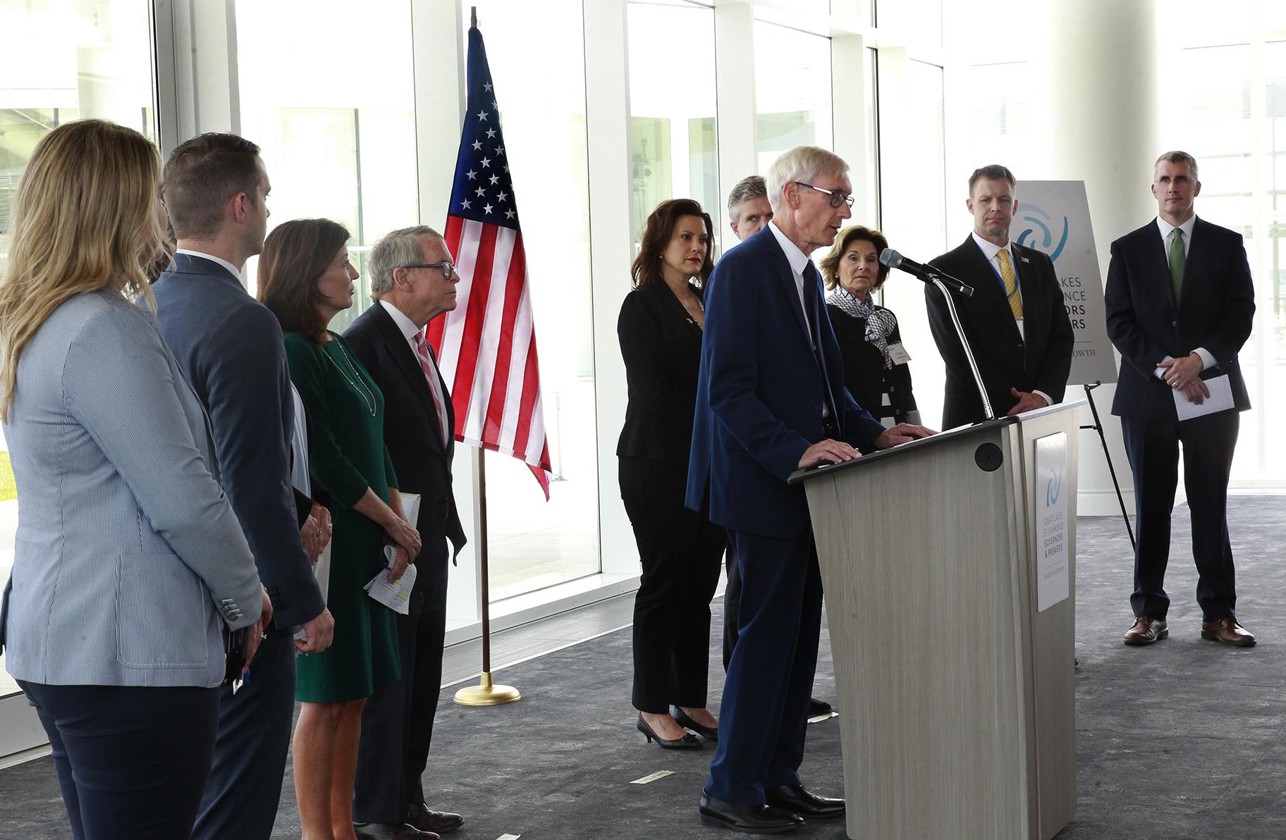 Wisconsin Gov. Tony Evers, center, is joined by other governors and premiers during a press conference at the 2019 Leadership Summit at the Discovery World, Friday, June 14, 2019, in Milwaukee, Wis., where leaders discussed actions on water, transportation, impact investing and tourism as related to the Great Lakes and Saint Lawrence River. (Angela Peterson/Milwaukee Journal-Sentinel via AP)