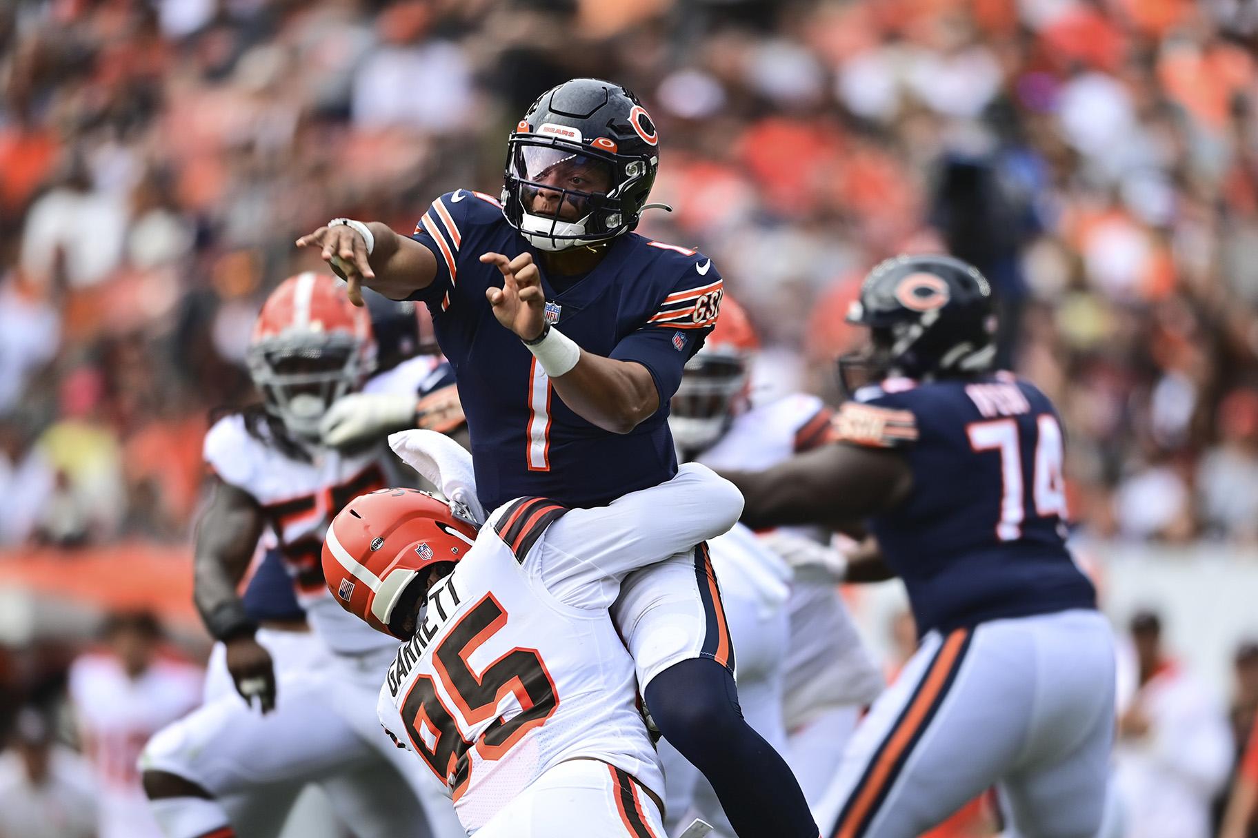 Chicago Bears quarterback Justin Fields (1) is hit by Cleveland Browns defensive end Myles Lorenz Garrett (95) after a pass during the second half of an NFL football game, Sunday, Sept. 26, 2021, in Cleveland. (AP Photo / David Dermer)