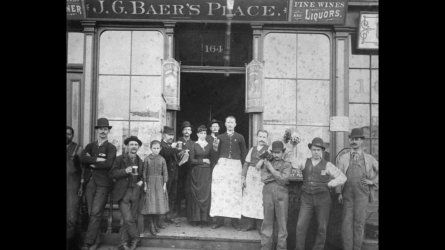 A group of Chicagoans outside J.G. Baer’s Place, where signs advertise pilsners made by the C. Seipp Brew Co., which survived the Great Chicago Fire of 1871. (Chicago History Museum)
