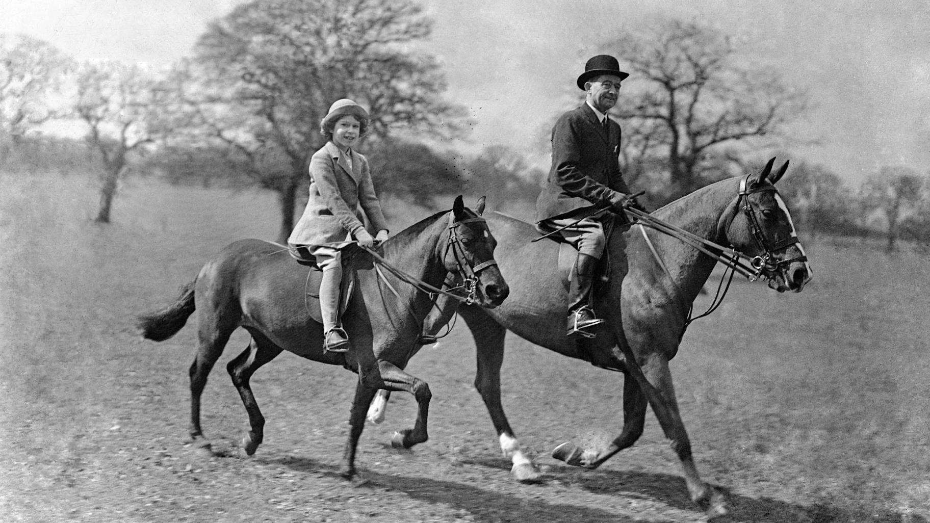 Princess Elizabeth on horseback with the riding master in Windsor Great Park, Windsor, England, in April 1935. (AP Photo, File)