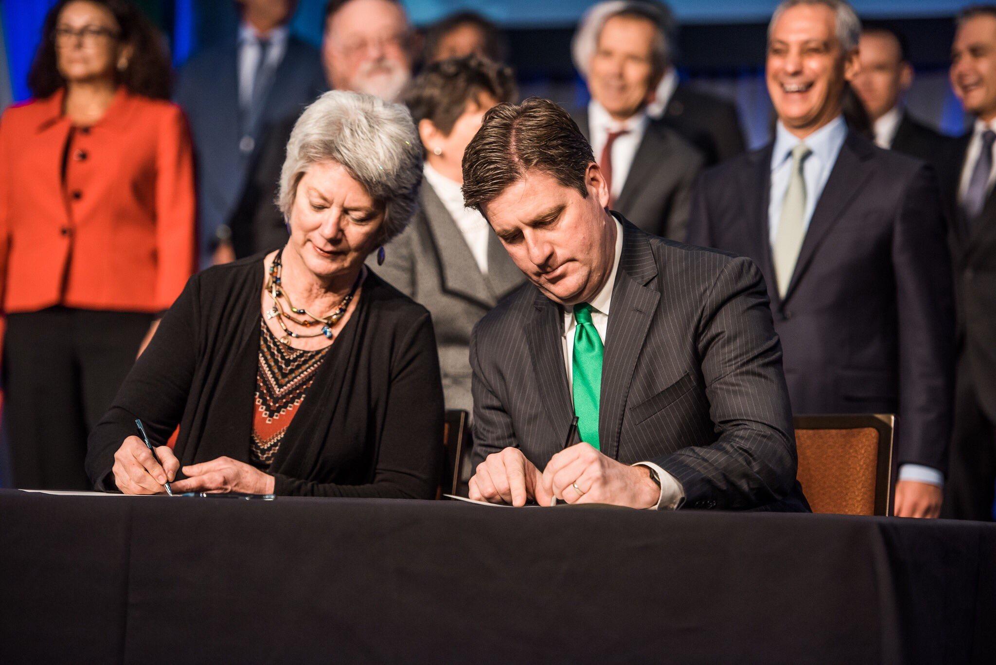 Pittsboro, N.C. Mayor Cindy Perry and Pittsburgh Mayor Bill Peduto sign the Chicago Climate Charter on Tuesday. (Courtesy City of Pittsburgh)