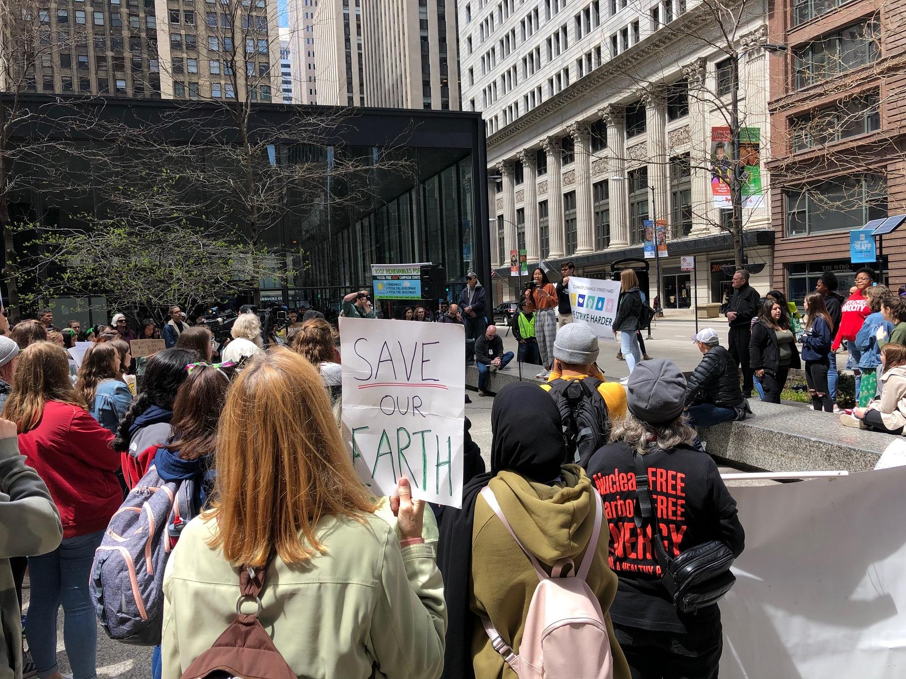 Students at the Illinois Youth Climate Strike listen to organizers during a rally in downtown Chicago on Friday, May 3, 2019. (Alex Ruppenthal / WTTW News)