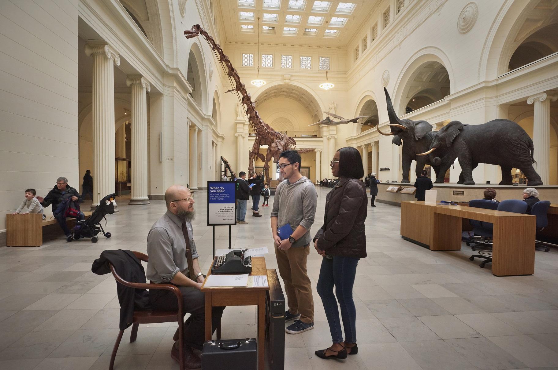Eric Elshtain talks with visitors in the Field Museum’s Stanley Field Hall. (John Weinstein / The Field Museum)