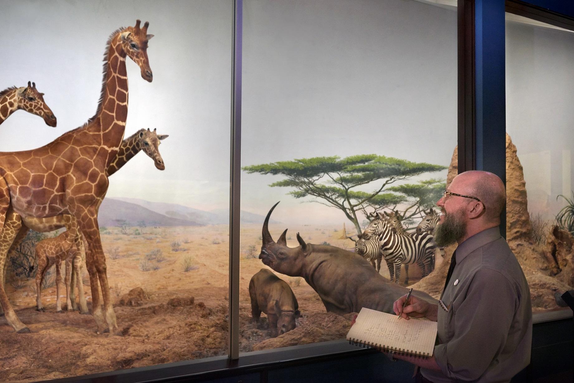 Eric Elshtain takes notes as he tours the Field’s exhibits. (John Weinstein / The Field Museum)