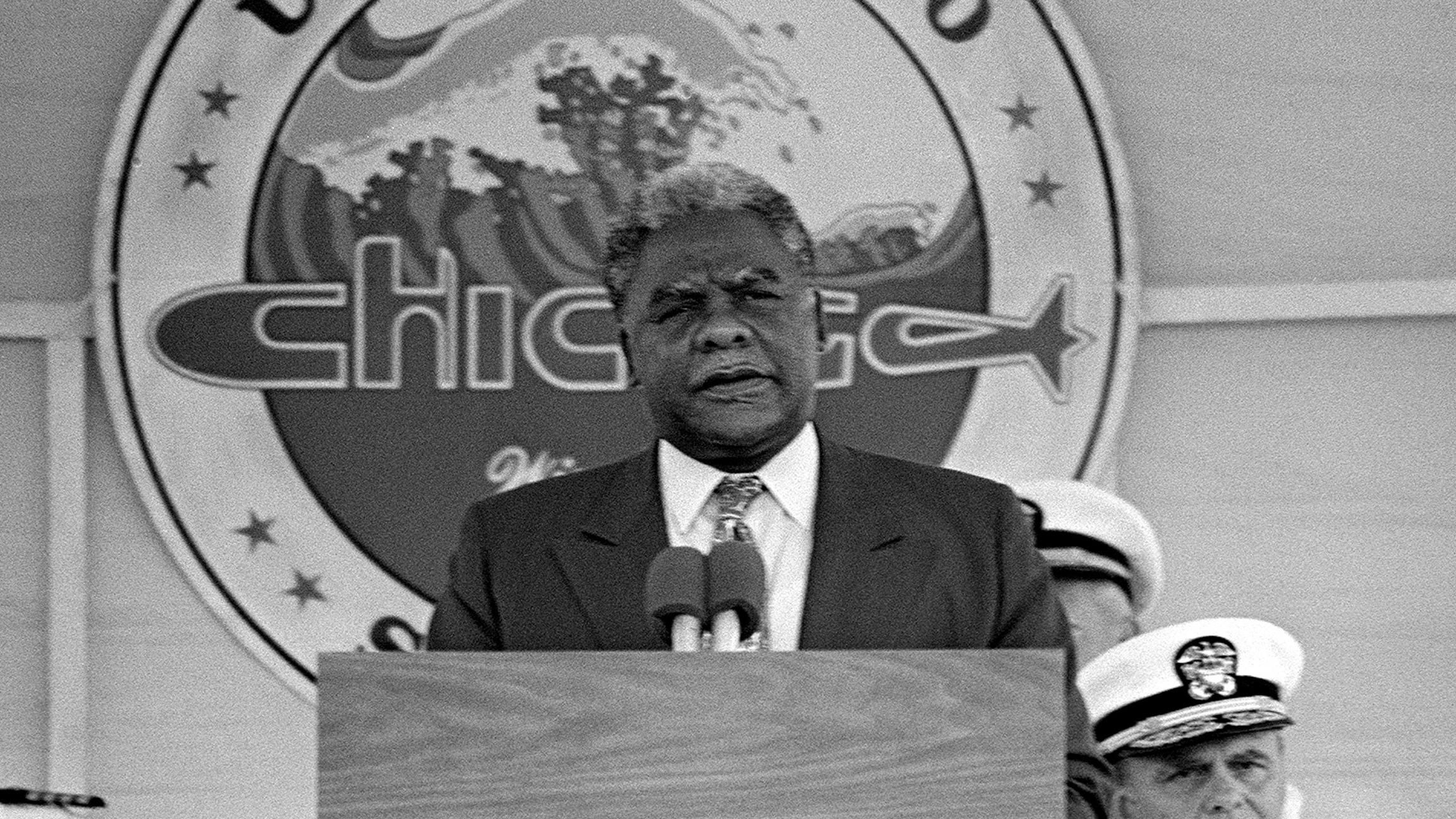 Chicago Mayor Harold Washington speaks during the commissioning of the nuclear-powered attack submarine USS Chicago in September 1986 in Norfolk, Virginia.