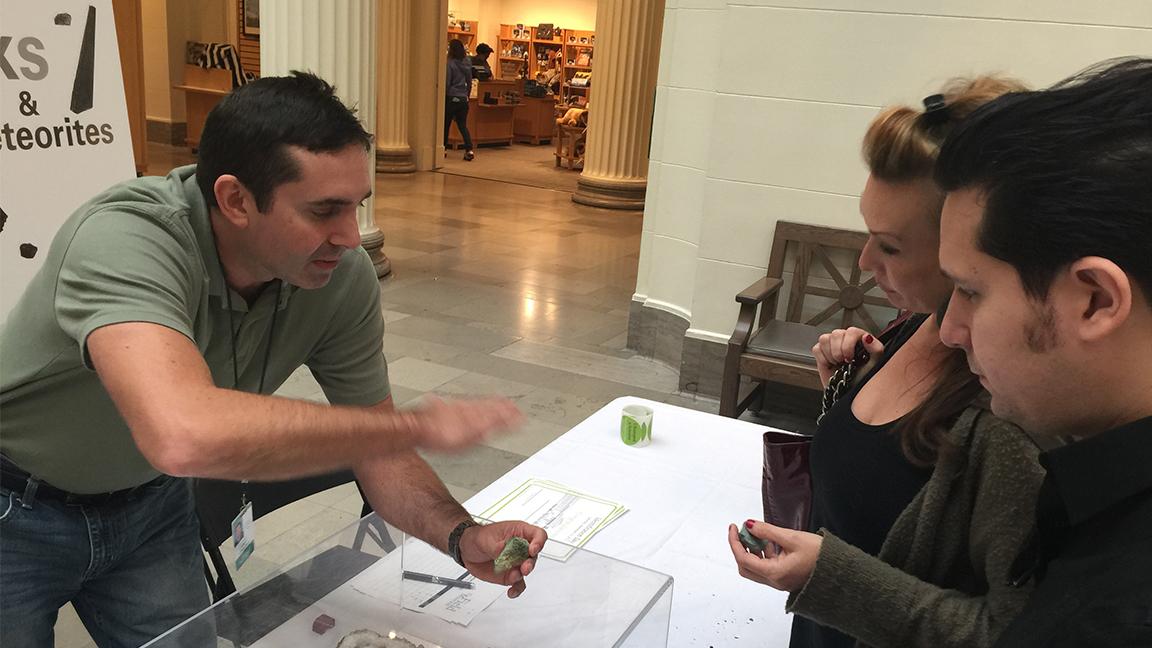 Jim Holstein, collections manager of geology at the Field Museum, examines a mineral at the museum’s Identification Day in 2015. (Courtesy of the Field Museum)