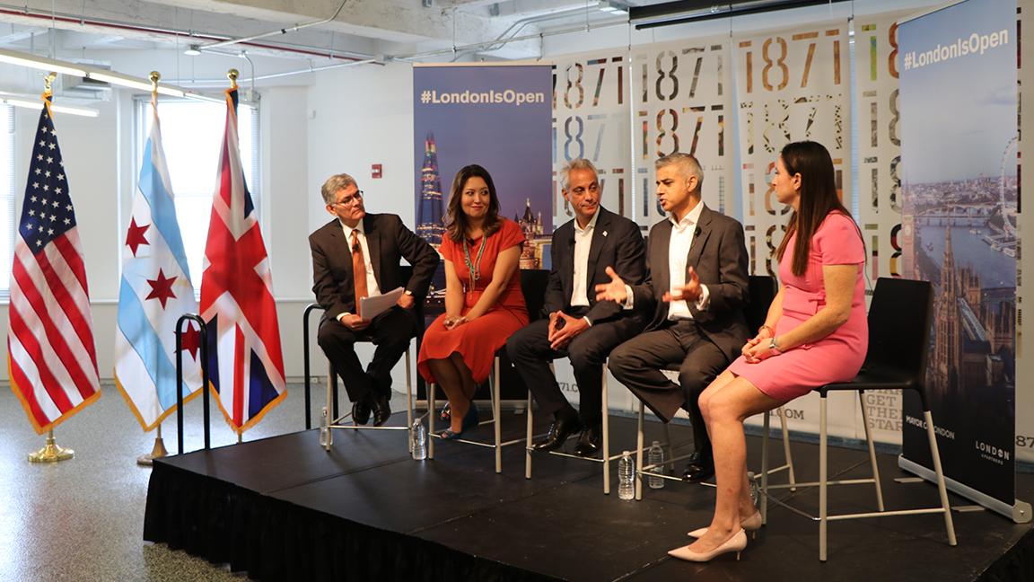 “Chicago Tonight” host Phil Ponce moderates a panel discussion at 1871 with Mayor of London Sadiq Khan, Chicago Mayor Rahm Emanuel, and Rumi Morales, left, executive director of invest company CME Ventures, and U.K. entrepreneur Emma Sinclair, right. (Evan Garcia / Chicago Tonight)