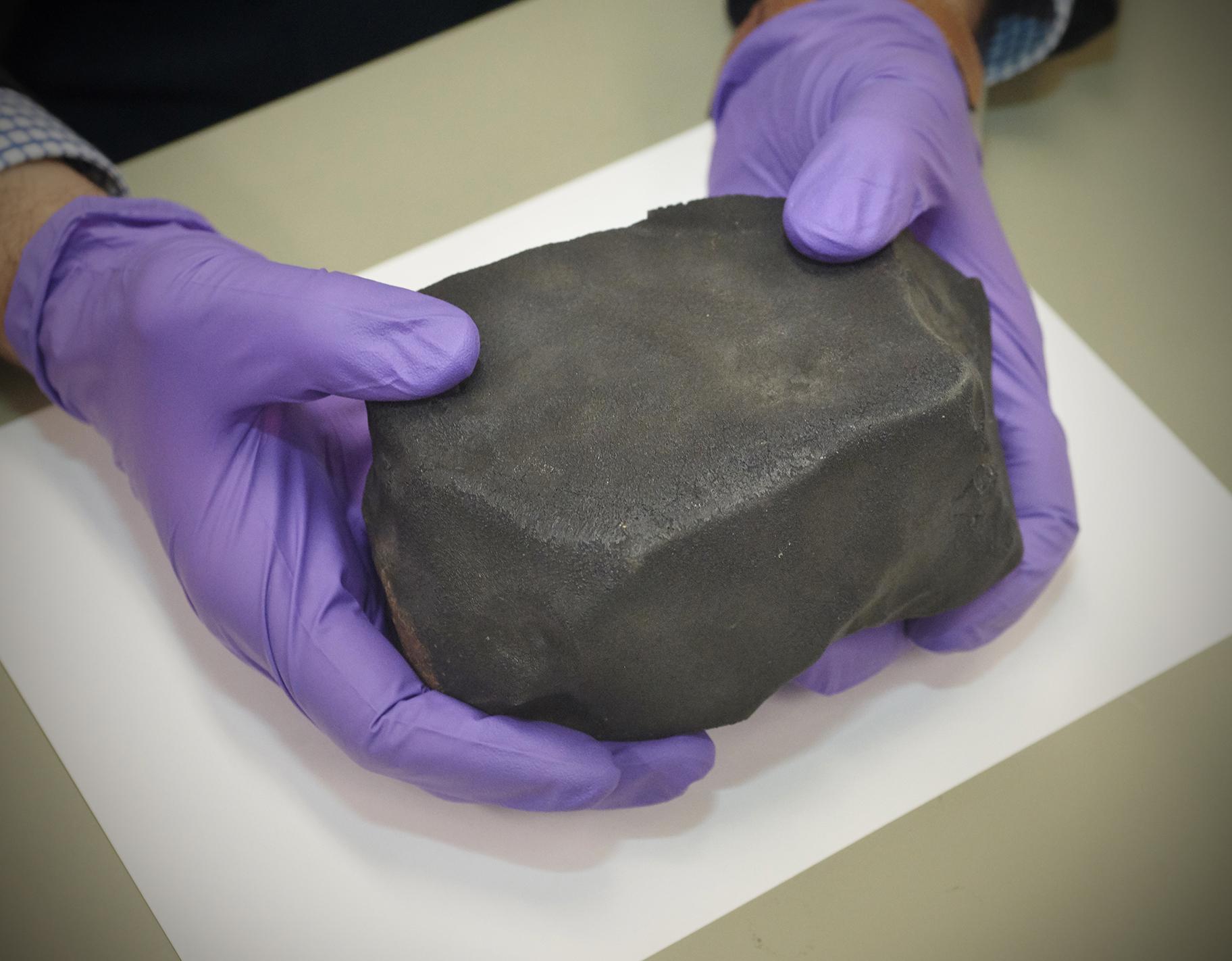 A 4-pound piece of a meteorite that struck Costa Rica earlier this year was handed over to the Field Museum on Oct. 7, 2019. (John Weinstein / Field Museum) 