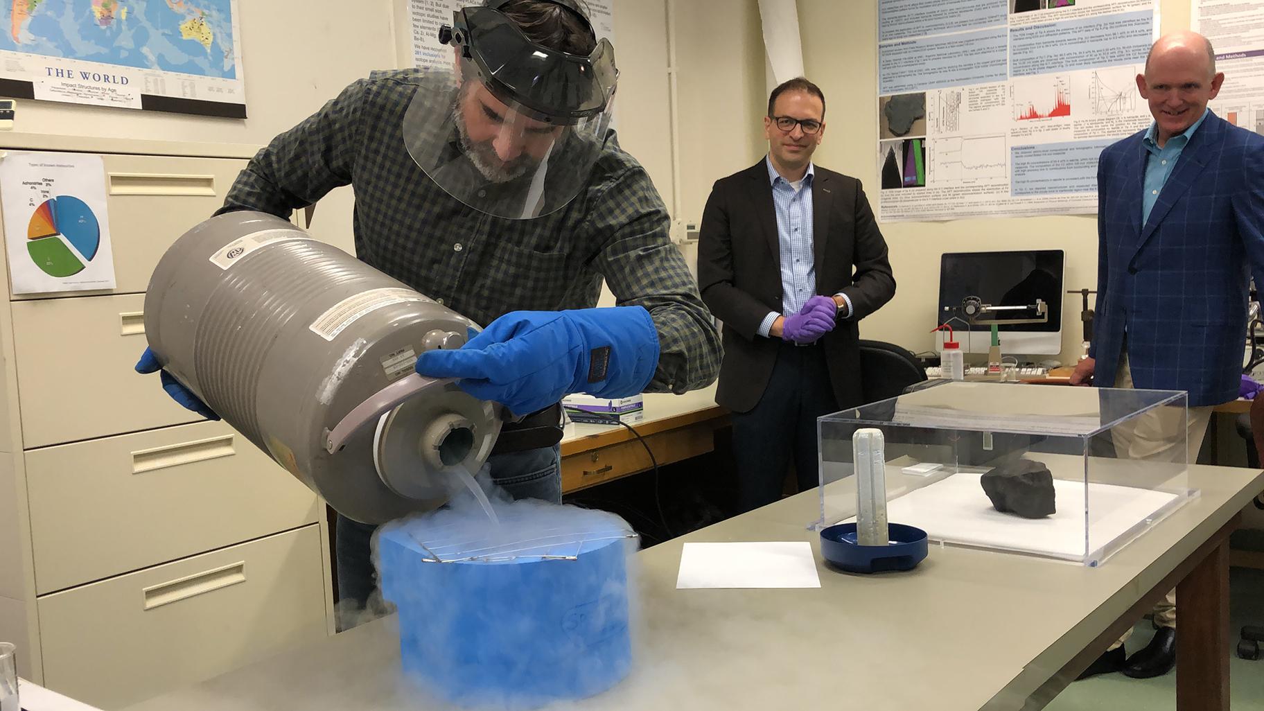 The Field Museum’s Jim Holstein shows how the meteorite will be stored and preserved using liquid nitrogen cooled to negative 320 degrees Fahrenheit. (Alex Ruppenthal / WTTW News) 