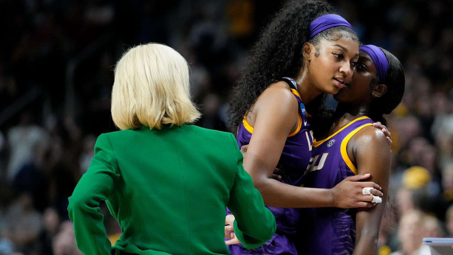 LSU forward Angel Reese (10) and LSU guard Flau'jae Johnson (4) talk as Reese leaves the court during the fourth quarter of an Elite Eight round college basketball game during the NCAA Tournament, Monday, April 1, 2024, in Albany, N.Y. (Mary Altaffer / AP Photo)