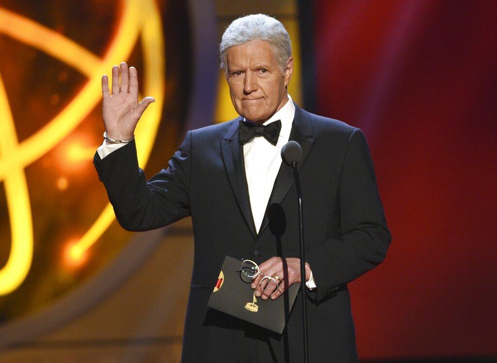 This May 5, 2019, file photo shows Alex Trebek gestures while presenting an award at the 46th annual Daytime Emmy Awards in Pasadena, Calif. (Photo by Chris Pizzello / Invision / AP, File)