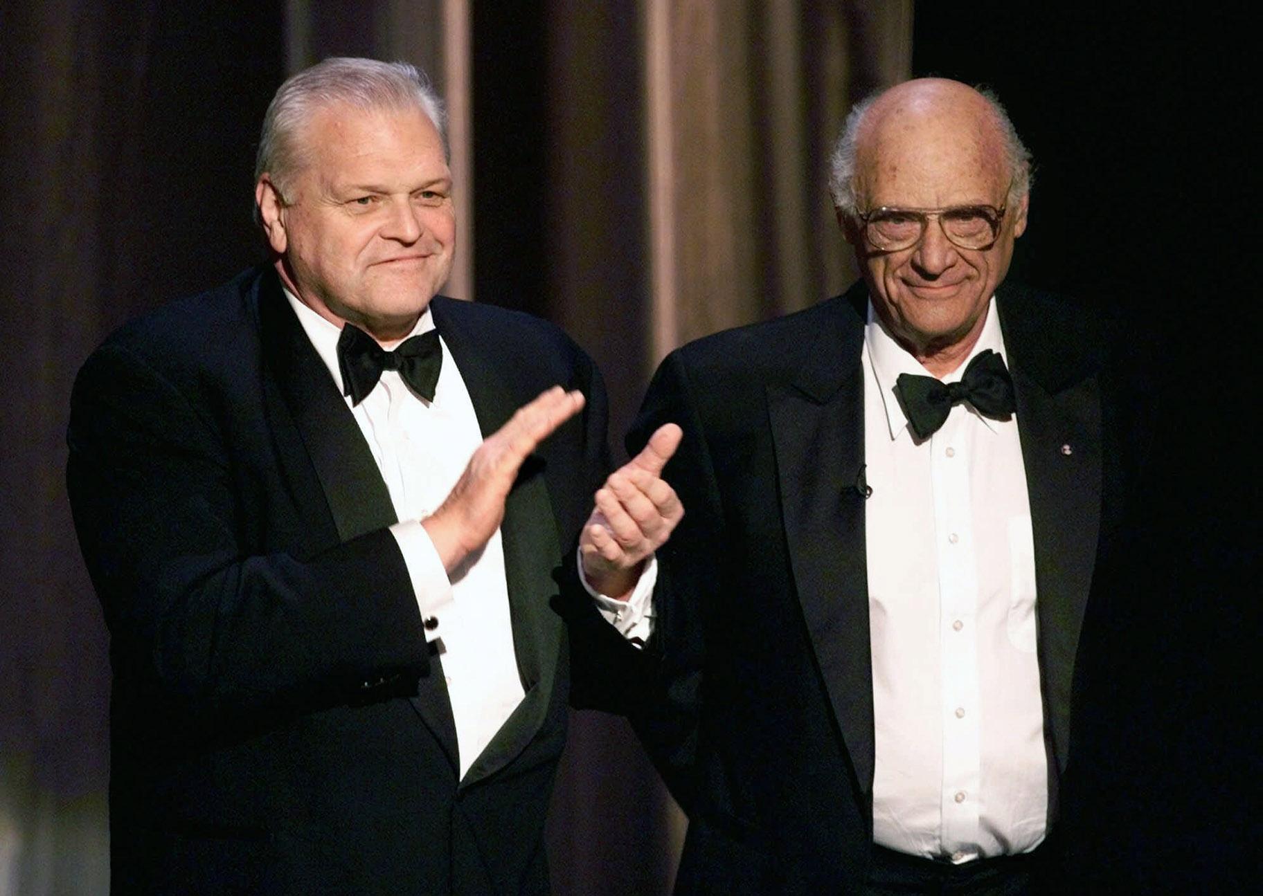 In this June 6, 1999 file photo, actor Brian Dennehy, left, applauds playwright, Arthur Miller, before awarding him the Lifetime Achievement Award at the Tony Awards in New York. (AP Photo / Kathy Willens, File)