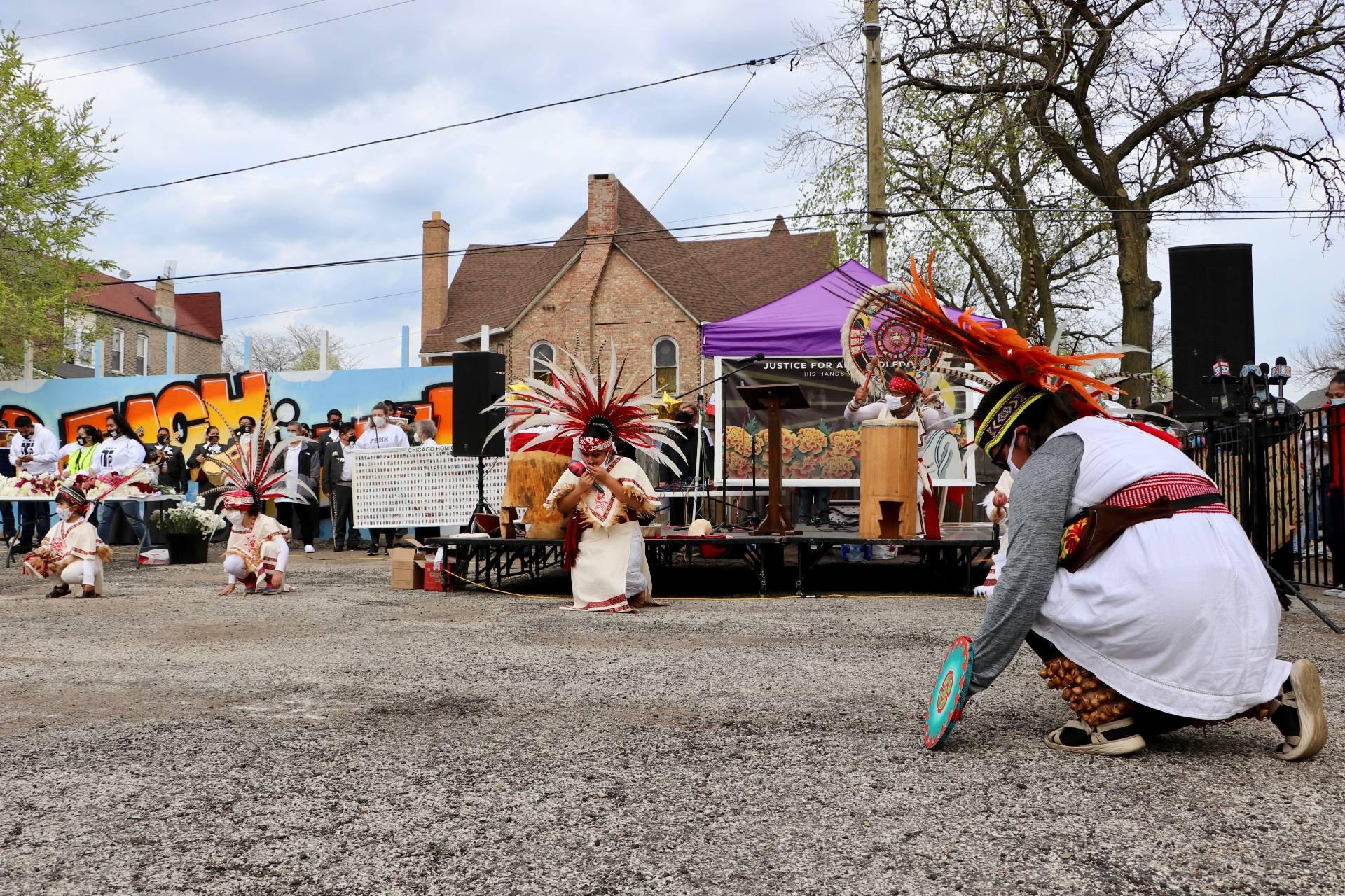 An Aztec dance is performed at the opening of a peace walk on April 18, 2021 for 13-year-old Adam Toledo, a Little Village resident fatally shot by police on March 29, 2021. (Evan Garcia / WTTW News)