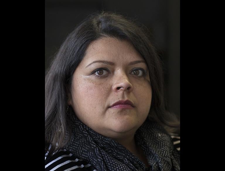 Olga Bautista, secretary of the Southeast Environmental Task Force. Bautista is one of several community activists who protested oil refineries in her neighborhood. (Terry Evans / Courtesy of Museum of Contemporary Photography)