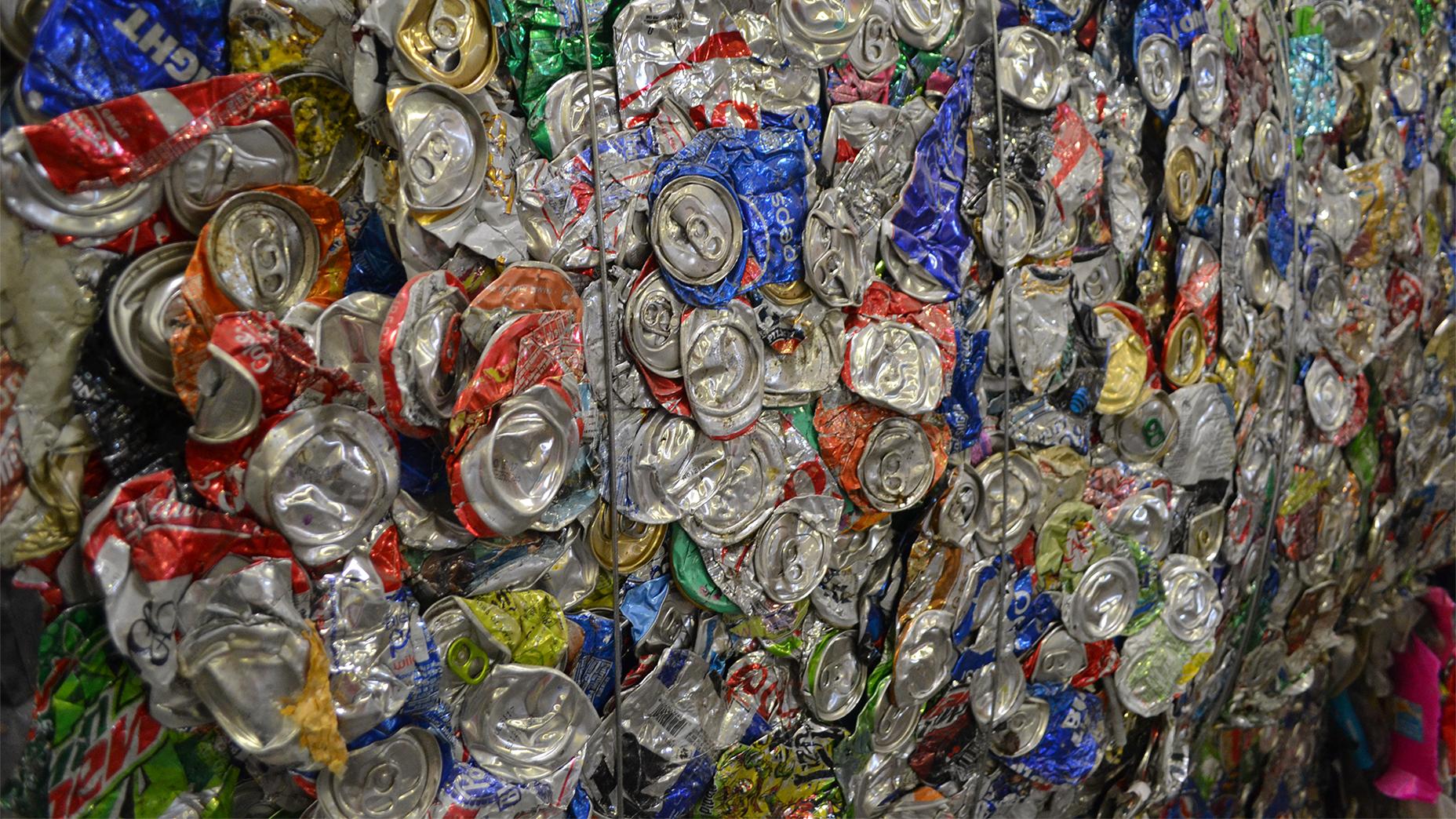 Aluminum cans bundled together in large bales at one of Chicago's recycling facilities wait to be transferred into a container and delivered elsewhere. (Alex Ruppenthal / Chicago Tonight)