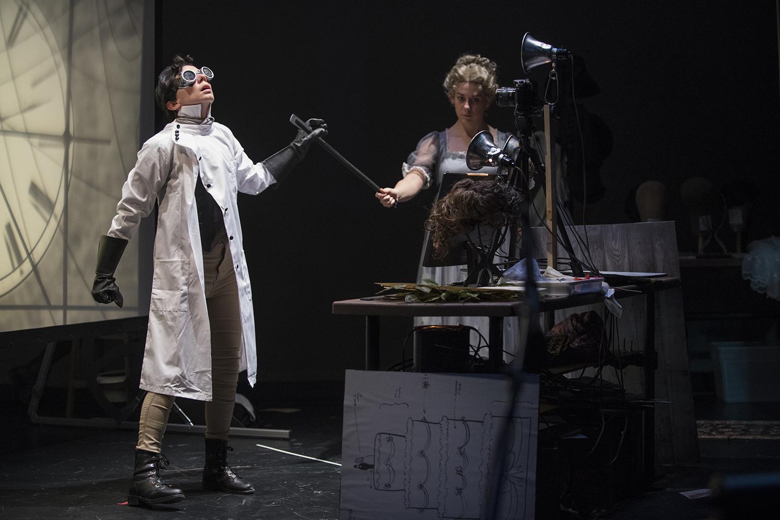 Sarah Fornace, left, and Julia Miller in “Frankenstein” by Manual Cinema at Court Theatre. (Photo by Michael Brosilow)