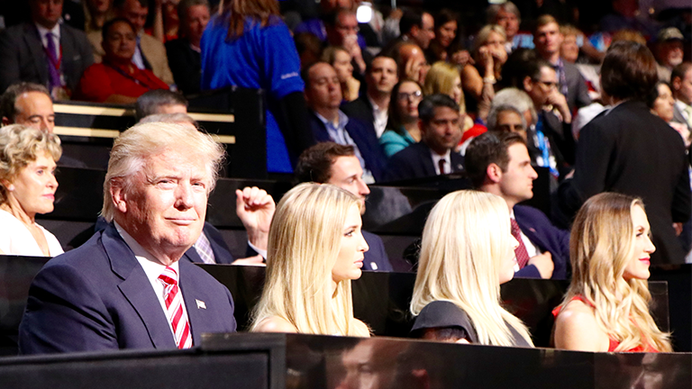 Republican presidential nominee sits with his daughters Ivanka and Tiffany during his son Eric's speech on the third day of the Republican National Convention. (Evan Garcia / Chicago Tonight) 