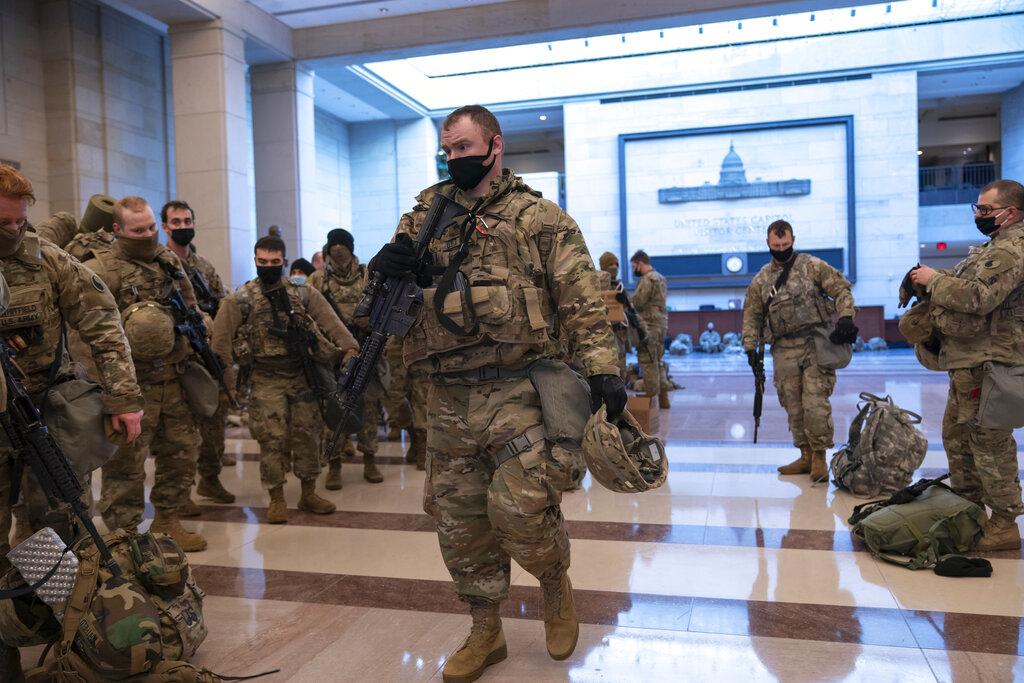 Hundreds of National Guard troops hold inside the Capitol Visitor’s Center to reinforce security at the Capitol in Washington, Wednesday, Jan. 13, 2021. (AP Photo / J. Scott Applewhite)