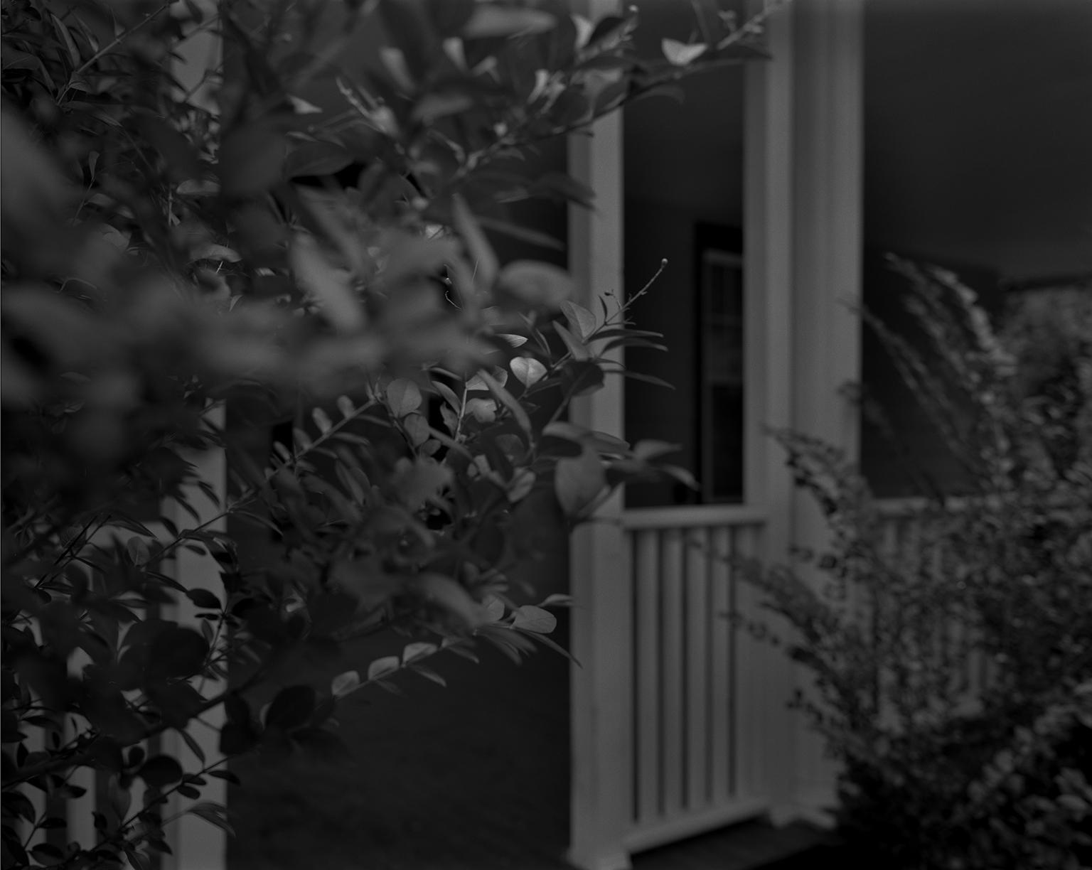 Dawoud Bey. “Untitled #4 (Leaves and Porch),” from the series “Night Coming Tenderly, Black,” 2017. Rennie Collection, Vancouver. © Dawoud Bey.