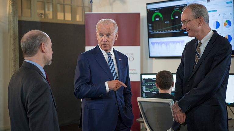 Vice President Joe Biden talks with professor Robert Grossman, left, director of Center for Data Intensive Science at the University of Chicago, and Louis M. Staudt of the National Cancer Institute as they tour the Genomic Data Commons on June 6. (Robert Kozloff)