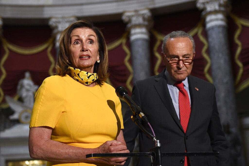 House Speaker Nancy Pelosi of Calif., left, speaks as she stands next to Senate Minority Leader Sen. Chuck Schumer of N.Y., right, on Capitol Hill in Washington, Monday, Aug. 3, 2020. (AP Photo / Susan Walsh)