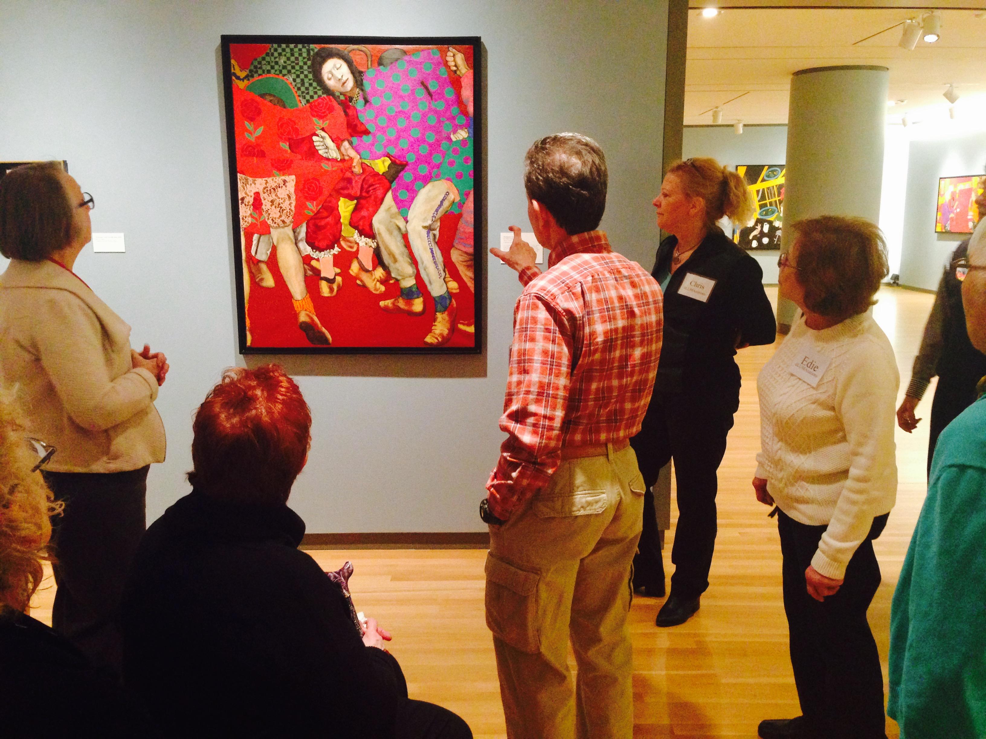 A group of Alzheimer’s patients and their caregivers tour the Loyola University Museum of Art exhibit. 