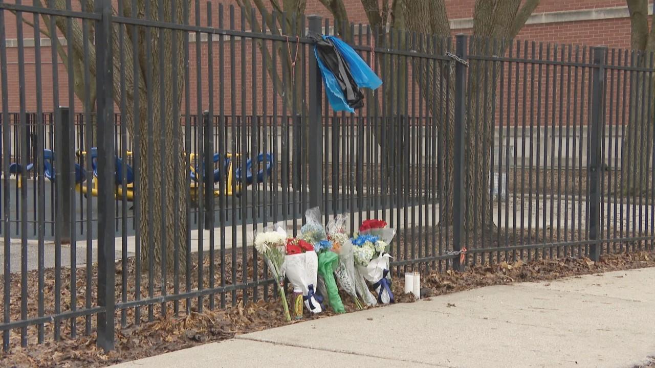 A memorial outside Sawyer Elementary School near where Officer Andres Vasquez-Lasso was shot and killed is pictured on March 2, 2023. (WTTW News)