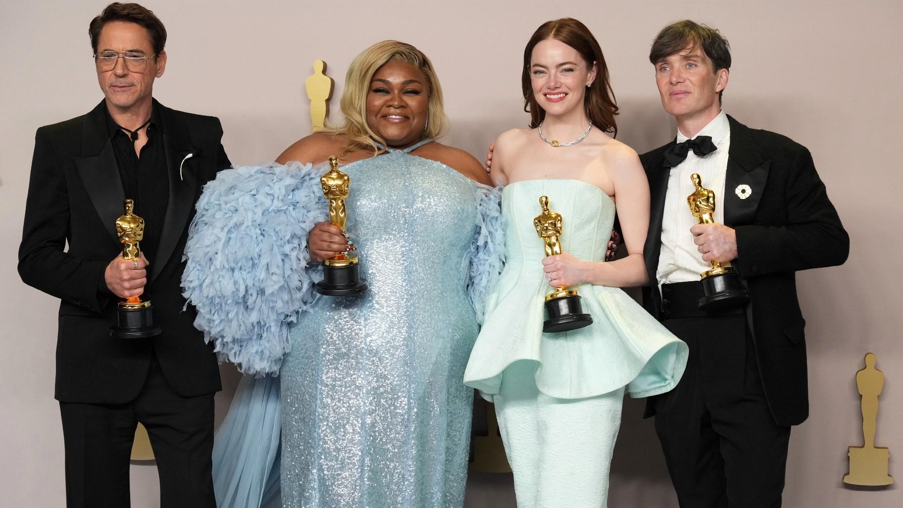 Robert Downey Jr., winner of the award for best performance by an actor in a supporting role for "Oppenheimer," from left, Da'Vine Joy Randolph, winner of the award for best performance by an actress in a supporting role for "The Holdovers," Emma Stone, winner of the award for best performance by an actress in a leading role for "Poor Things," and Cillian Murphy, winner of the award for best performance by an actor in a leading role for "Oppenheimer," pose in the press room at the Oscars on Sunday, March 10