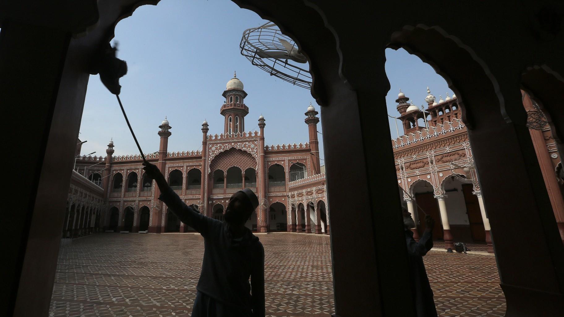 A worker cleans an area in the historical Sunehri mosque, ahead of the upcoming Muslim fasting month of Ramadan, in Peshawar, Pakistan, Wednesday, March 22, 2023. (AP Photo / Muhammad Sajjad)