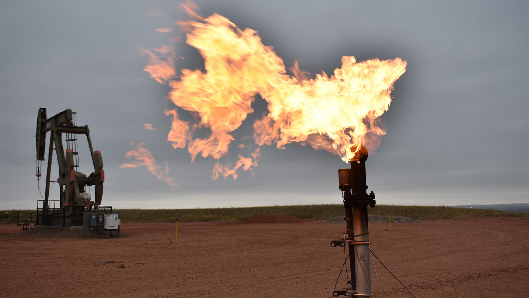 A flare burns natural gas at an oil well Aug. 26, 2021, in Watford City, N.D. (AP Photo / Matthew Brown, File)