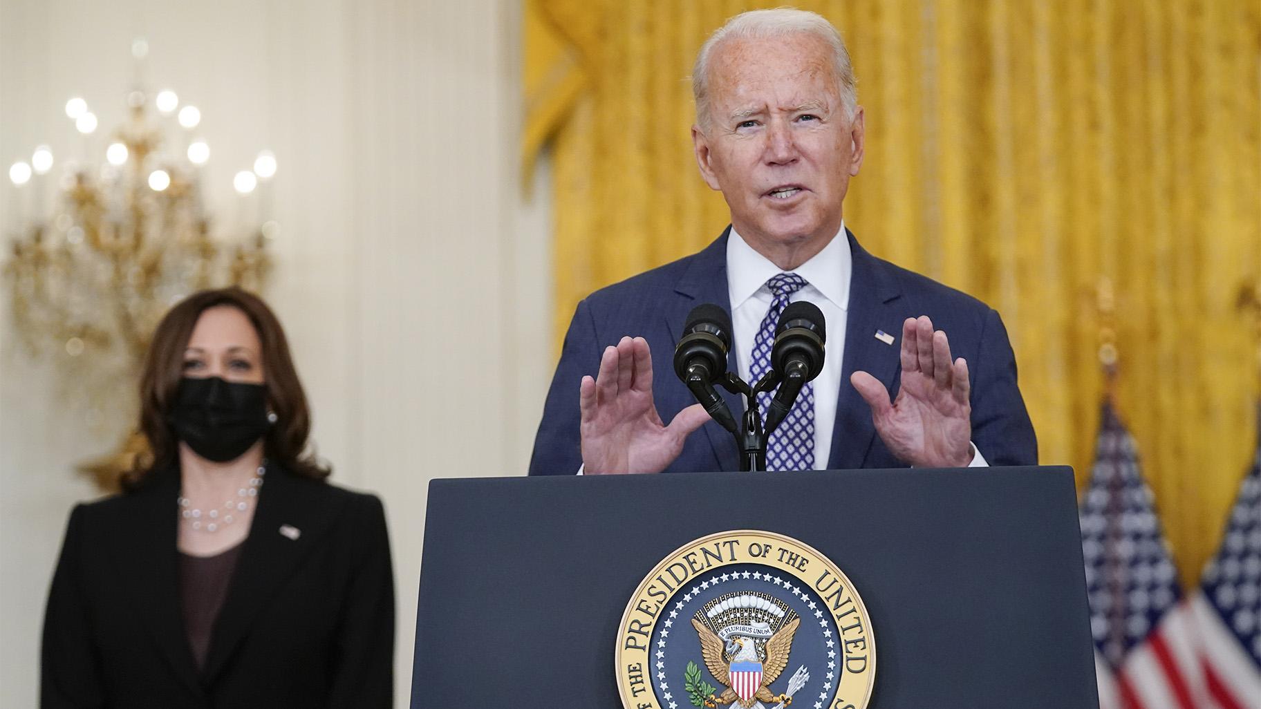 President Joe Biden speaks about the evacuation of American citizens, their families, SIV applicants and vulnerable Afghans in the East Room of the White House, Friday, Aug. 20, 2021, in Washington. Vice President Kamala Harris listens at left. (AP Photo / Manuel Balce Ceneta)
