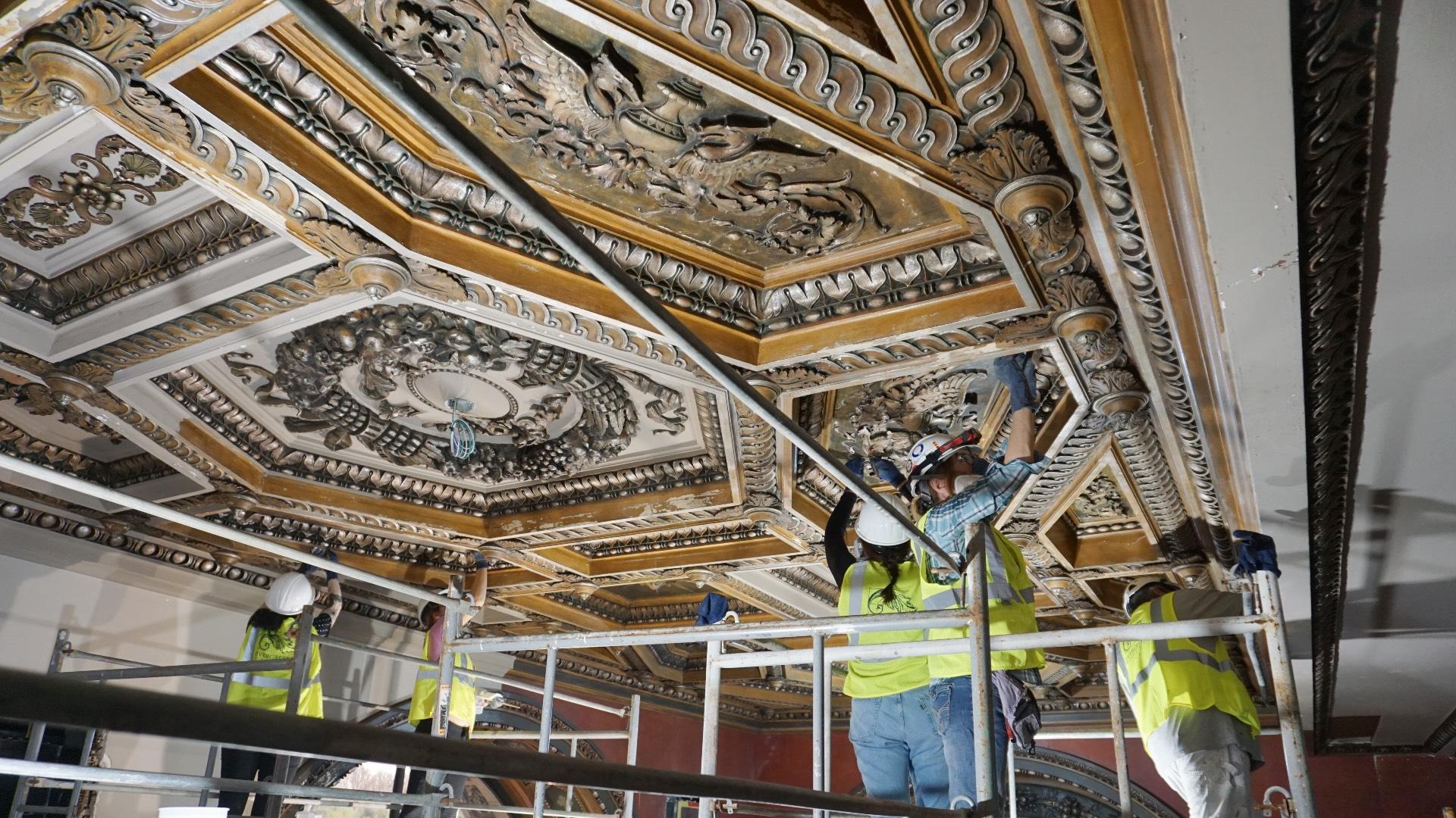 A team at work on restoring historic rooms in the Chicago Cultural Center to their original glory. (Courtesy of Harboe Architects)