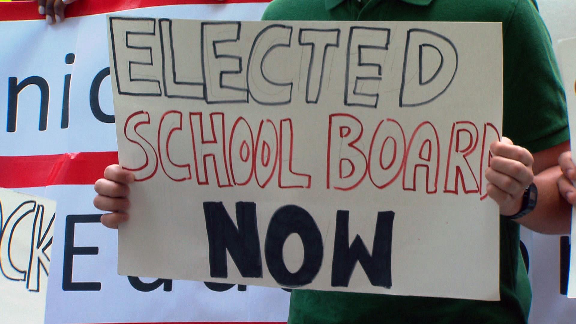 Supporters of an elected school board demonstrate in April 2019. (WTTW News)